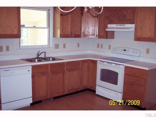 New flooring and New appliances, french door leads out to sunroom Kitchen