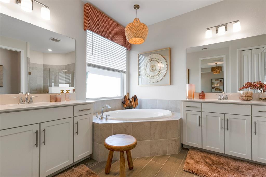 7157 Inlet Isles Lakewood Ranch, FL 34202 - Photo 24 of 26 a bathroom with a sink a toilet a mirror and a window