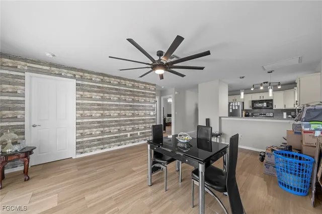 a view of a dining room with furniture and wooden floor