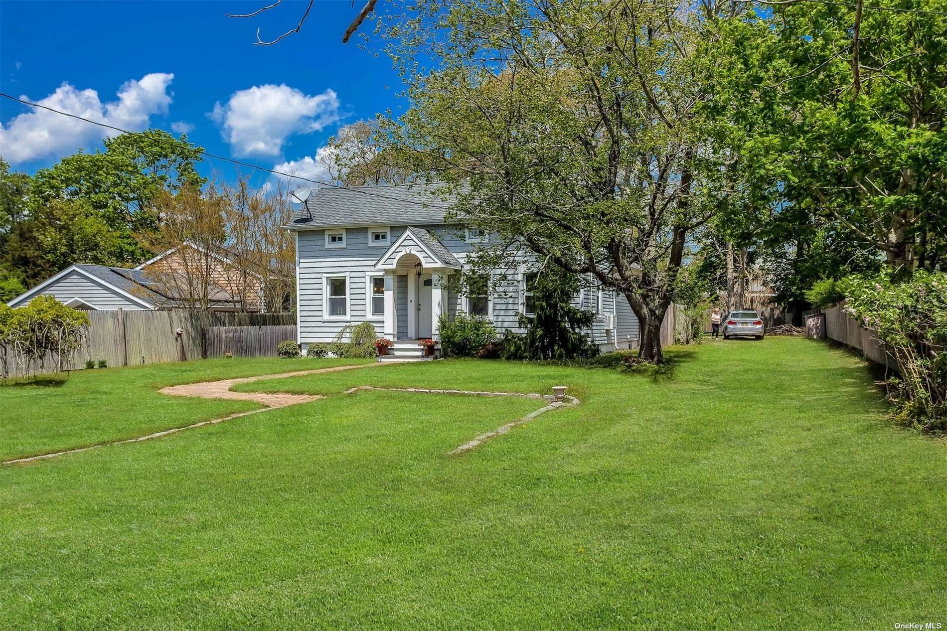 27 Shinnecock Road Hampton Bays, NY 11946 - Photo 1 of 1 a front view of house with yard and green space