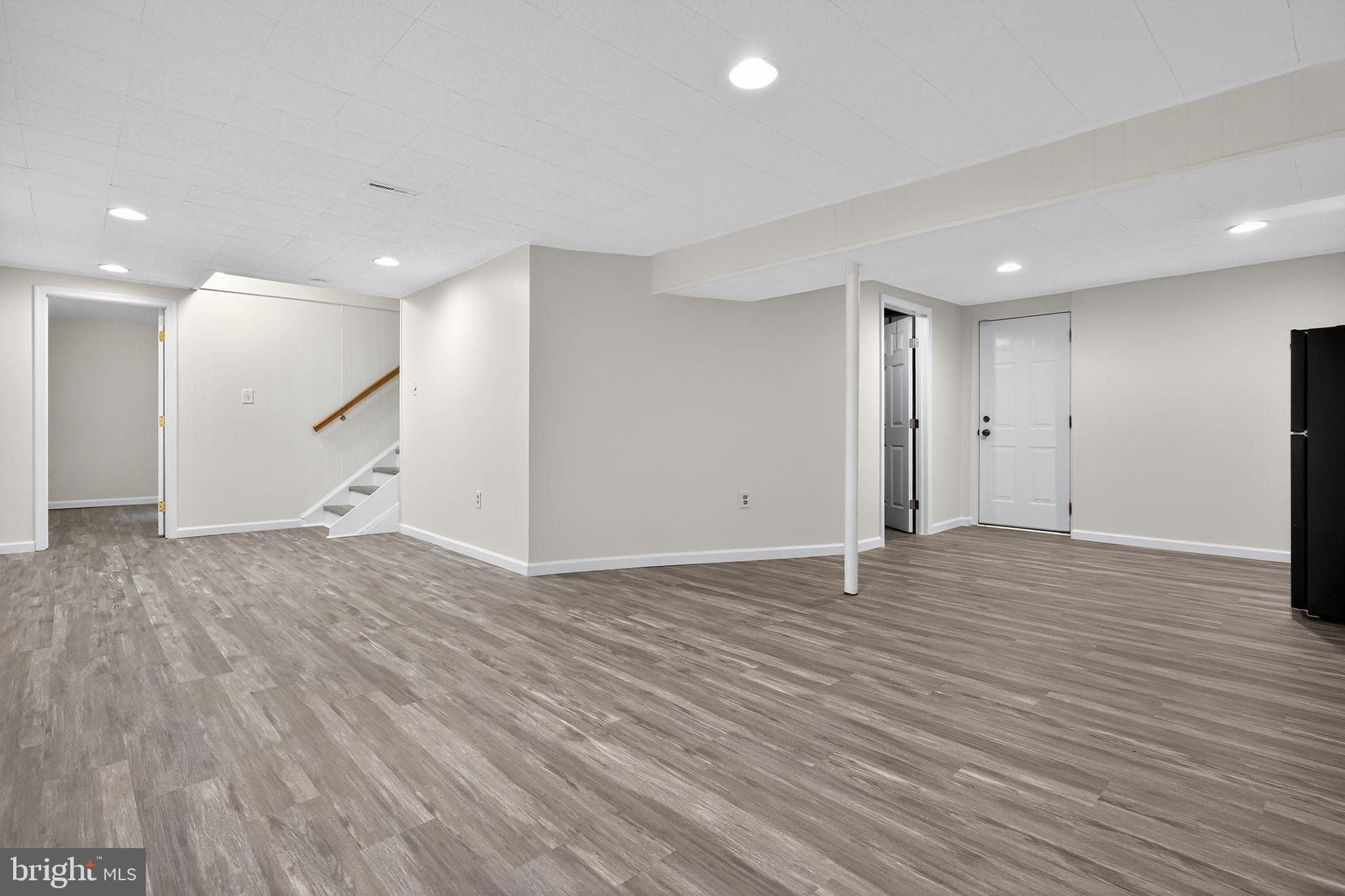 2196 Hallmark Court Gambrills, MD 21054 - Photo 12 of 14 a view of an empty room with wooden floor