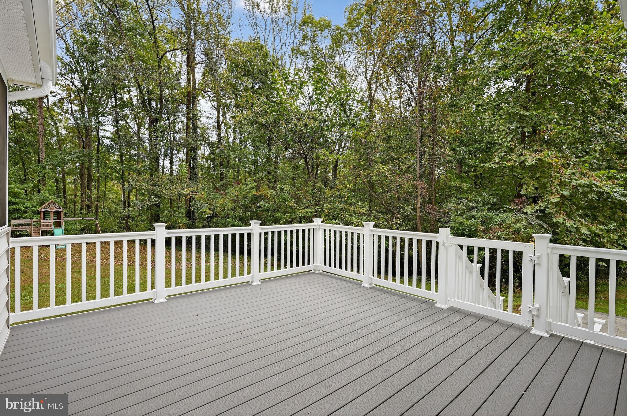 2196 Hallmark Court Gambrills, MD 21054 - Photo 6 of 14 a balcony with wooden floor and fence