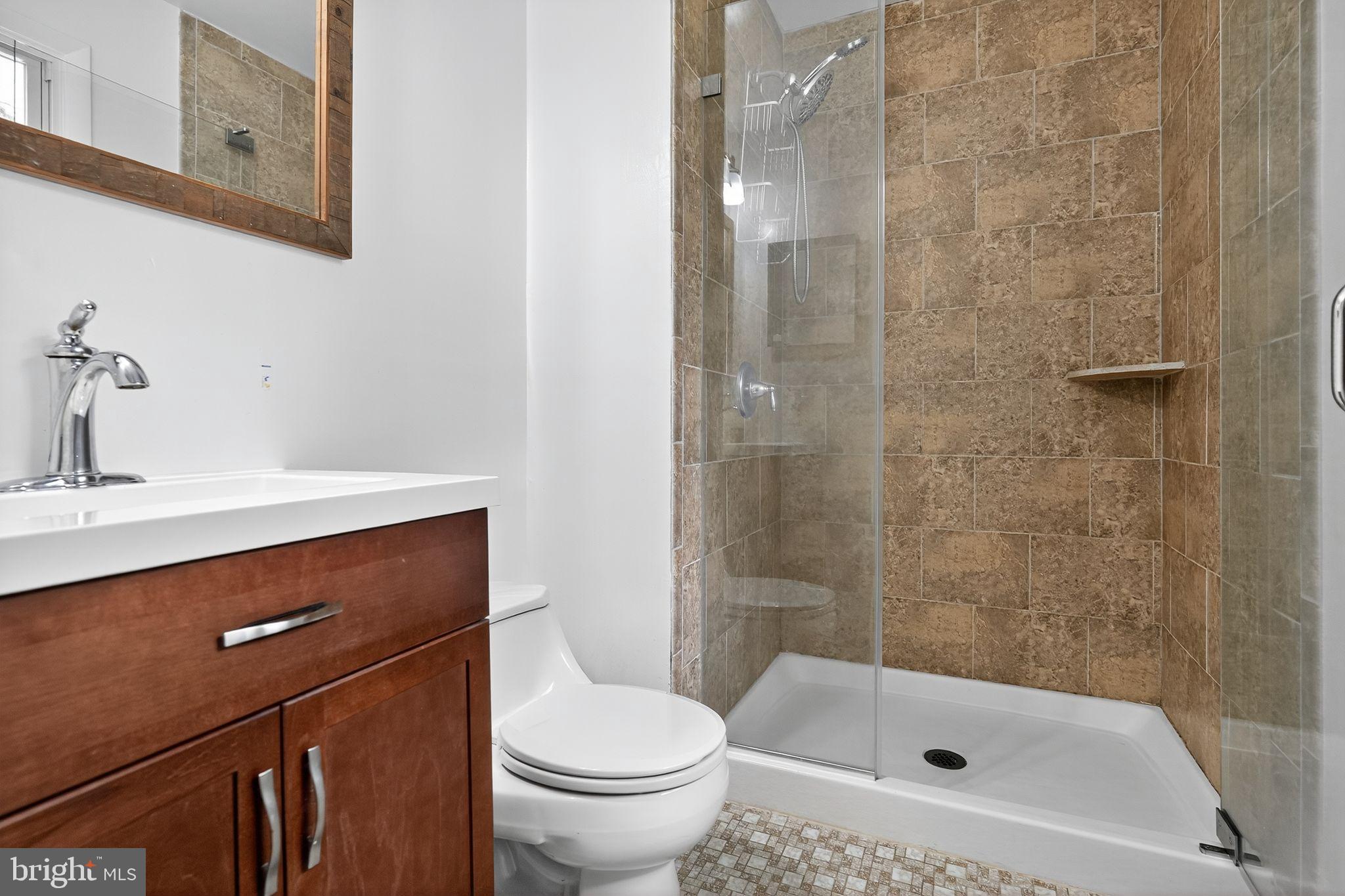 2196 Hallmark Court Gambrills, MD 21054 - Photo 8 of 14 a bathroom with a sink a toilet and shower