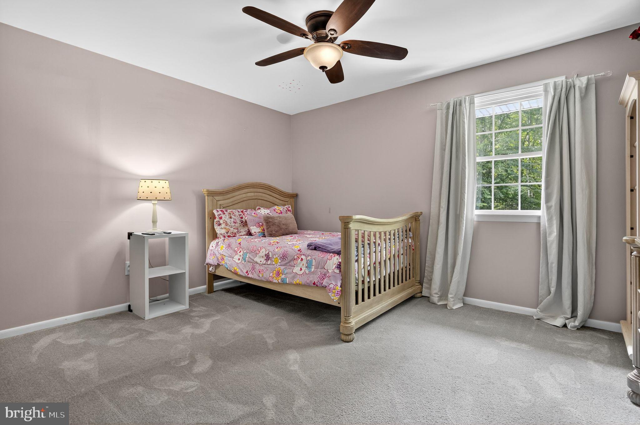 2196 Hallmark Court Gambrills, MD 21054 - Photo 9 of 14 a bedroom with a bed chandelier and a window