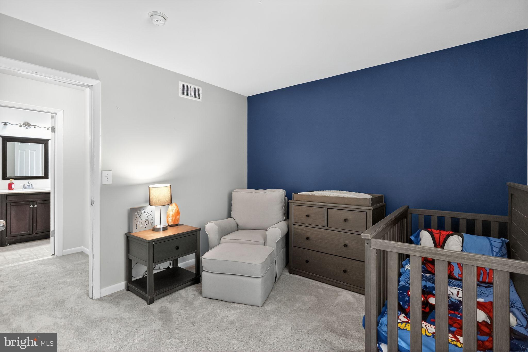 2196 Hallmark Court Gambrills, MD 21054 - Photo 10 of 14 a bedroom with furniture and a baby crib