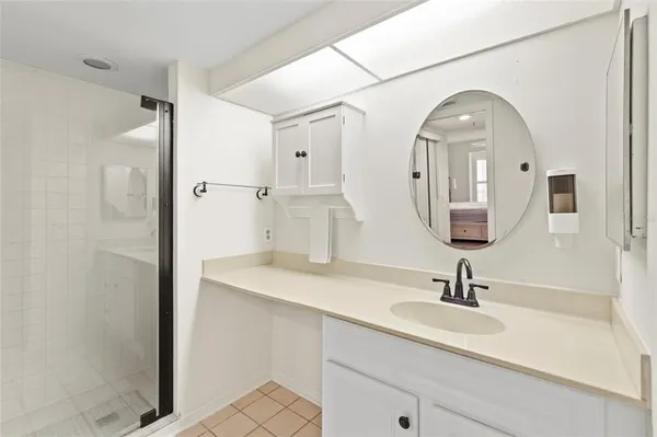 a bathroom with a double vanity sink mirror and
