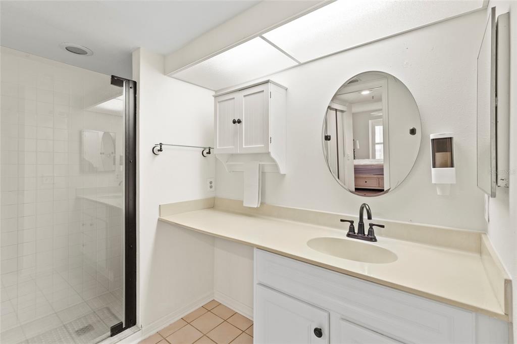 6611 Stone River Road, Unit 102 Bradenton, FL 34203 - Photo 11 of 23 a bathroom with a double vanity sink mirror and