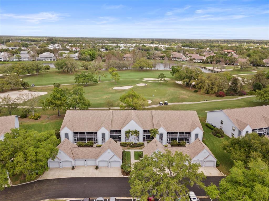 6611 Stone River Road, Unit 102 Bradenton, FL 34203 - Photo 19 of 23 an aerial view of residential houses with outdoor space and ocean view
