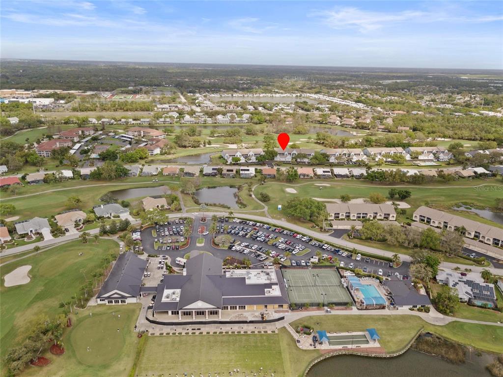 6611 Stone River Road, Unit 102 Bradenton, FL 34203 - Photo 22 of 23 an aerial view of residential houses with outdoor space