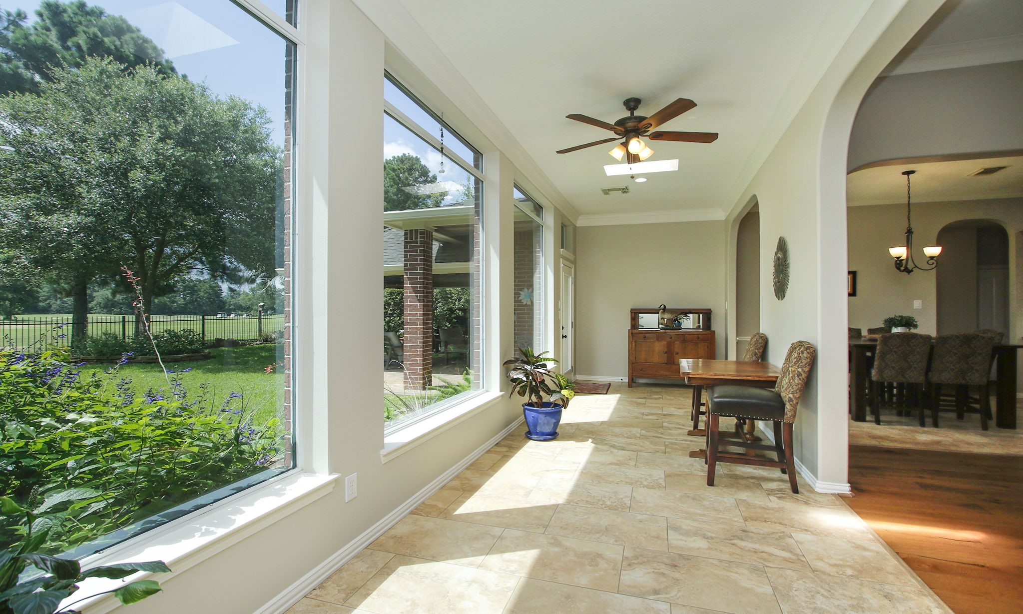 20110 Stormy Pine Lane Spring, TX 77379 - Photo 21 of 44 Step into a beautifully appointed sunroom filled with abundant natural light! Expansive windows offer year-round picturesque views of the coveted Windrose golf course.