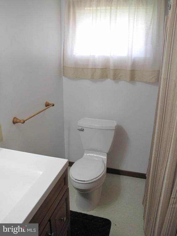 1178 Cider Press Road Manheim, PA 17545 - Photo 26 of 31 a white toilet sitting next to a bathroom sink