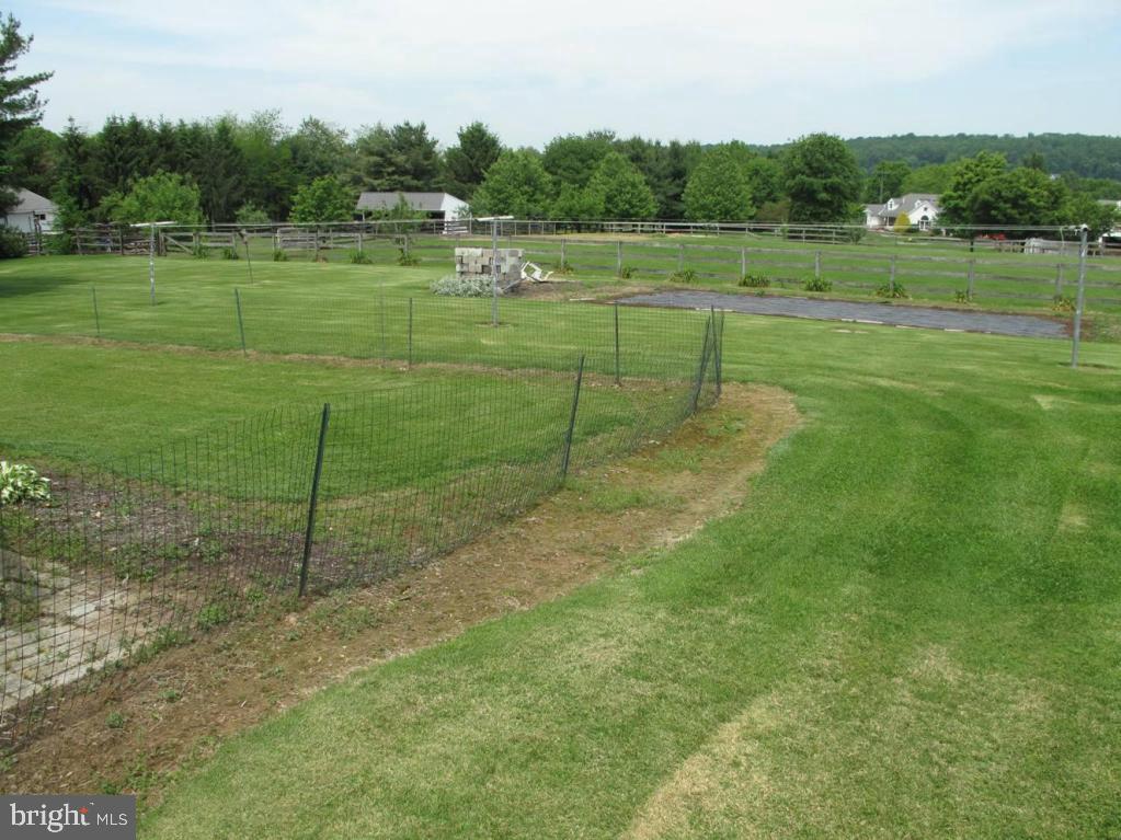 1178 Cider Press Road Manheim, PA 17545 - Photo 30 of 31 a view of a green field with wooden fence