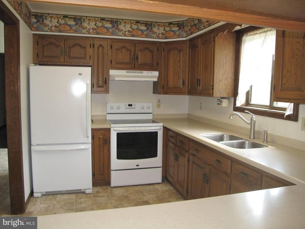 1178 Cider Press Road Manheim, PA 17545 - Photo 4 of 31 a kitchen with a sink and a refrigerator