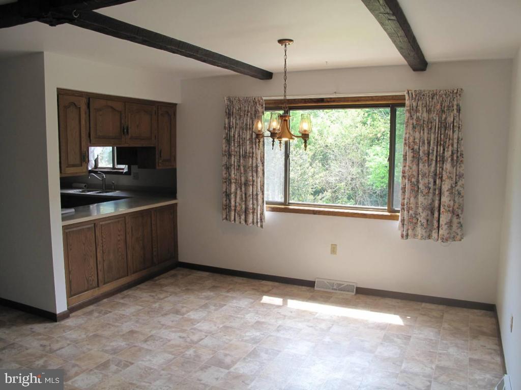 1178 Cider Press Road Manheim, PA 17545 - Photo 7 of 31 a view of a kitchen with a sink cabinet and window