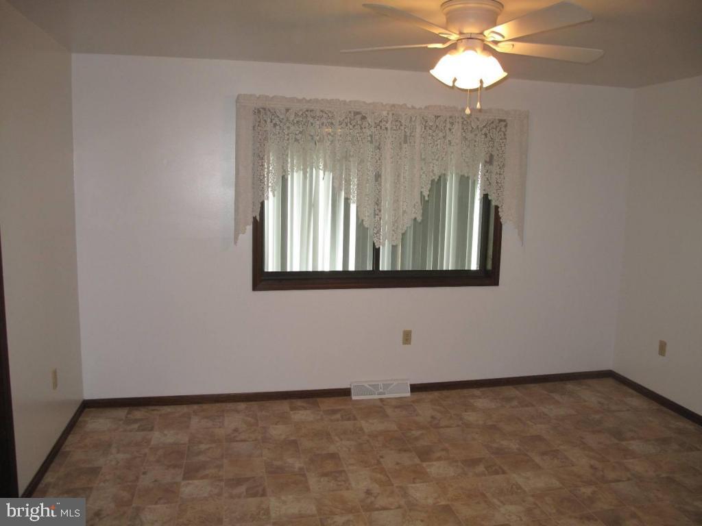 1178 Cider Press Road Manheim, PA 17545 - Photo 8 of 31 an empty room with windows and fan
