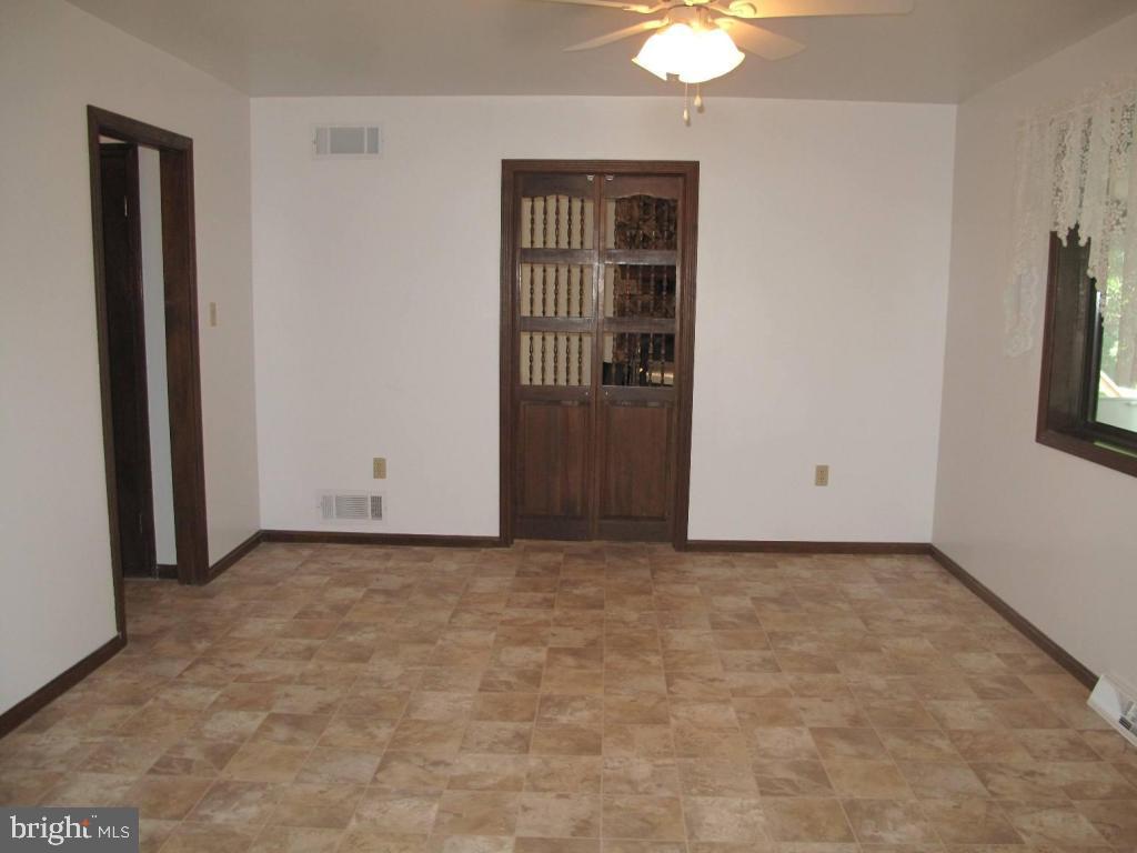 1178 Cider Press Road Manheim, PA 17545 - Photo 9 of 31 an empty room with closet and a chandelier fan