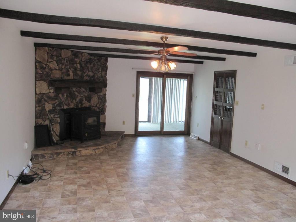 1178 Cider Press Road Manheim, PA 17545 - Photo 10 of 31 an empty room with windows and fireplace