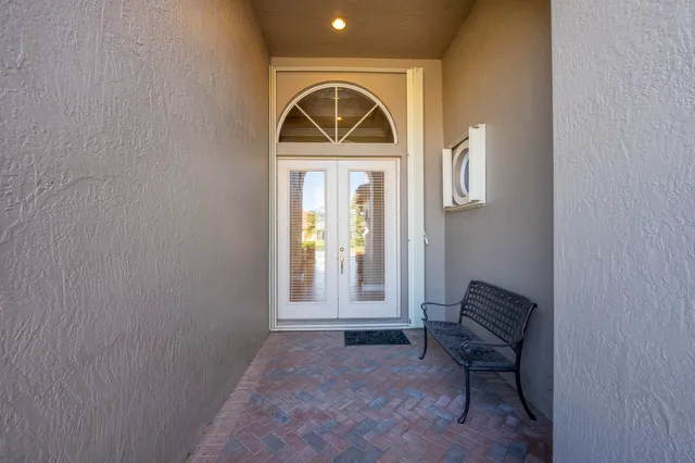 a view of a hallway with a chandelier
