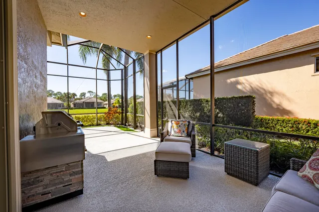 a swimming pool with outdoor seating and yard