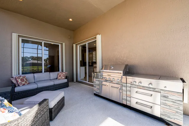 an aerial view of residential houses with outdoor space lake view