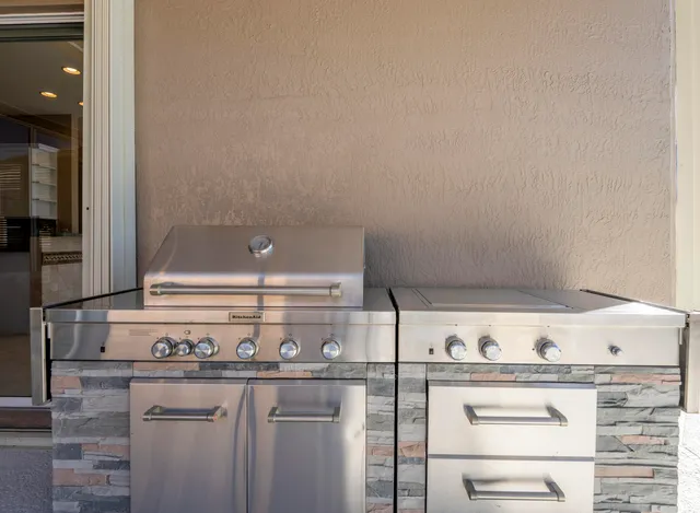 a swimming pool with lots of tress in front of it