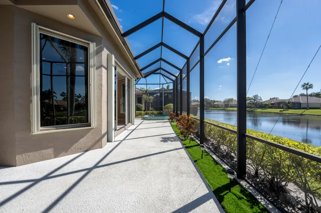 an outdoor space with furniture and umbrella