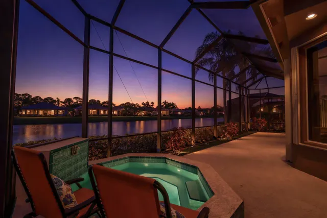 a living room with furniture a window and a flat screen tv