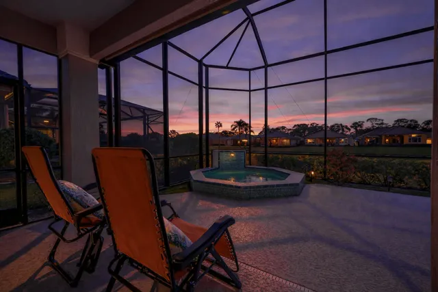 a large white kitchen with cabinets and furniture