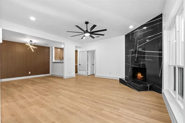 a view of an empty room with a fireplace