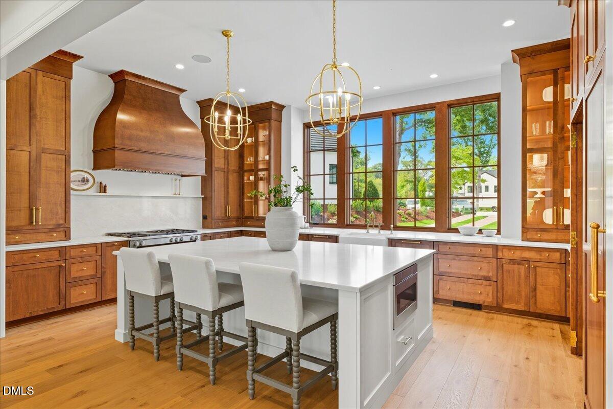 1216 Barcroft Place Raleigh, NC 27615 - Photo 17 of 91 a kitchen with stainless steel appliances granite countertop a stove and a refrigerator