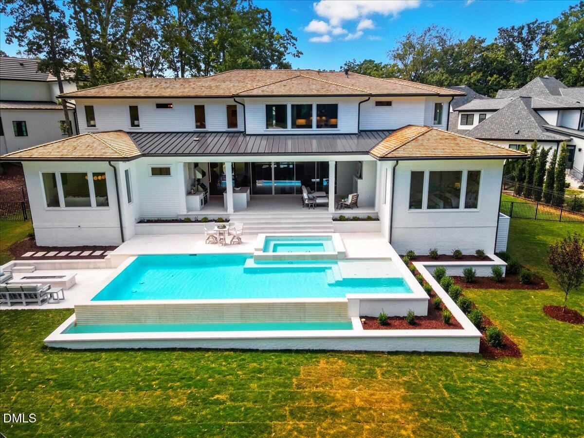 1216 Barcroft Place Raleigh, NC 27615 - Photo 3 of 91 a front view of a house with a yard table and chairs