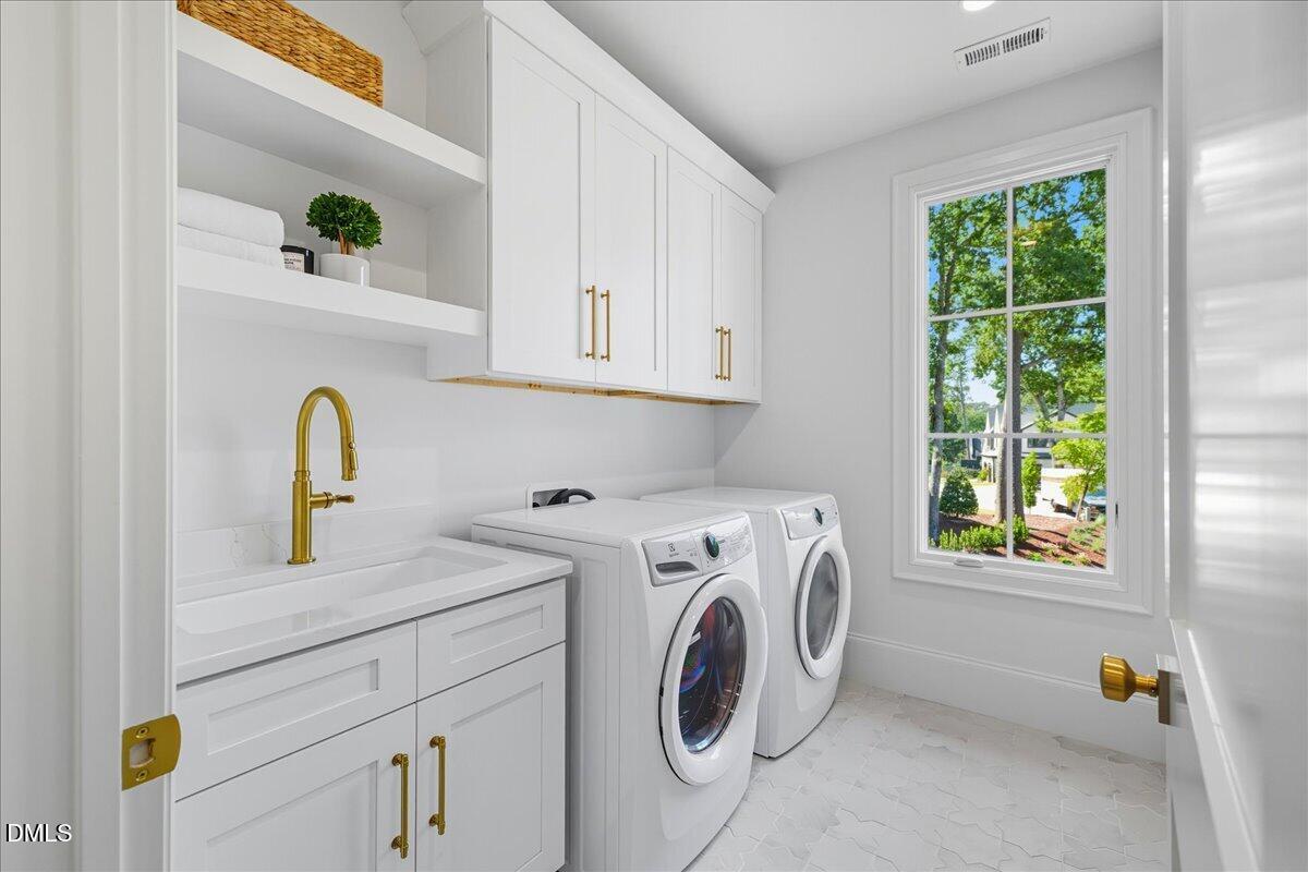 1216 Barcroft Place Raleigh, NC 27615 - Photo 65 of 91 a utility room with dryer and washer