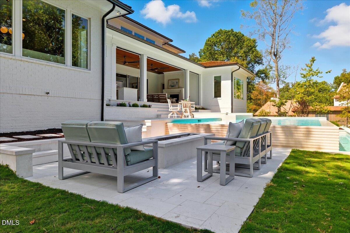 1216 Barcroft Place Raleigh, NC 27615 - Photo 78 of 91 a view of a house with backyard sitting area and garden