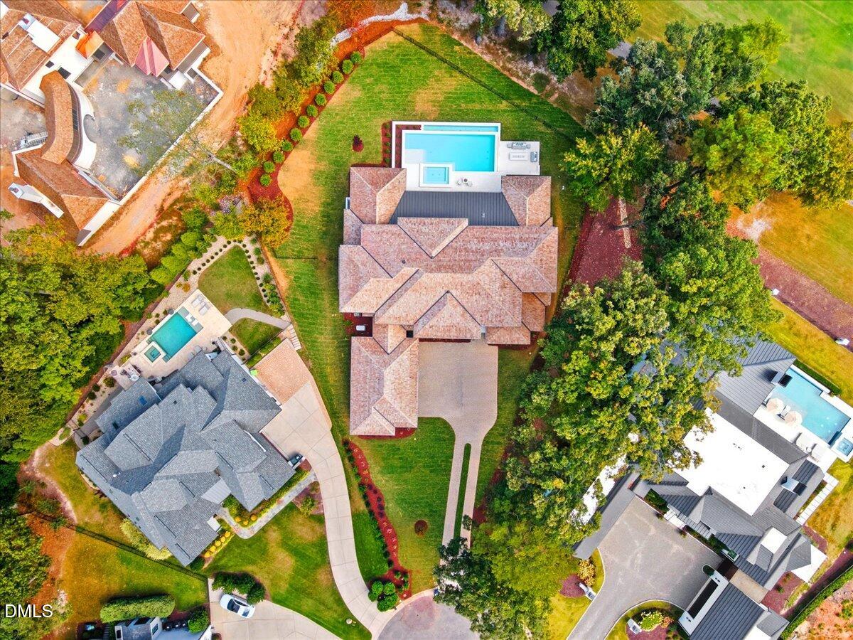 1216 Barcroft Place Raleigh, NC 27615 - Photo 82 of 91 an aerial view of a house with swimming pool and garden