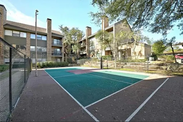 a view of a building with a yard