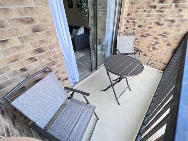 a view of balcony with furniture