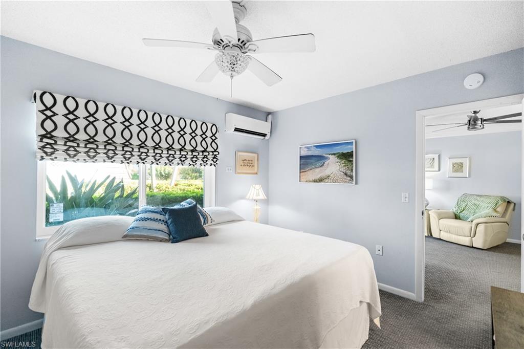 87 North Collier Boulevard, Unit B4 Marco Island, FL 34145 - Photo 13 of 31 a bedroom with a bed and a bed