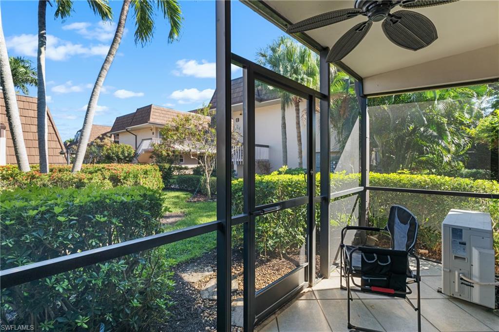 87 North Collier Boulevard, Unit B4 Marco Island, FL 34145 - Photo 17 of 31 a view of a porch with chairs and backyard