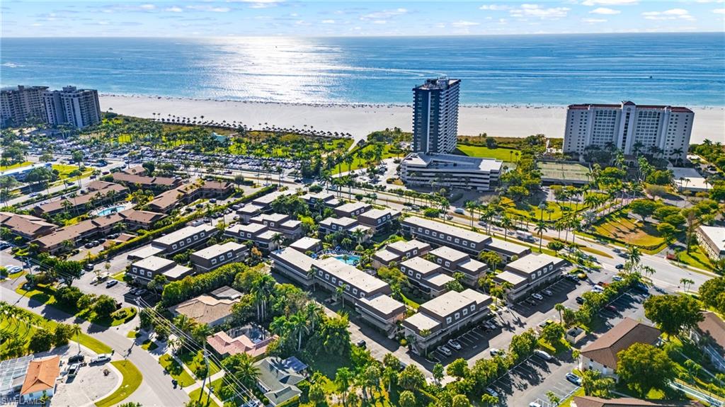 87 North Collier Boulevard, Unit B4 Marco Island, FL 34145 - Photo 18 of 31 a city view with tall buildings
