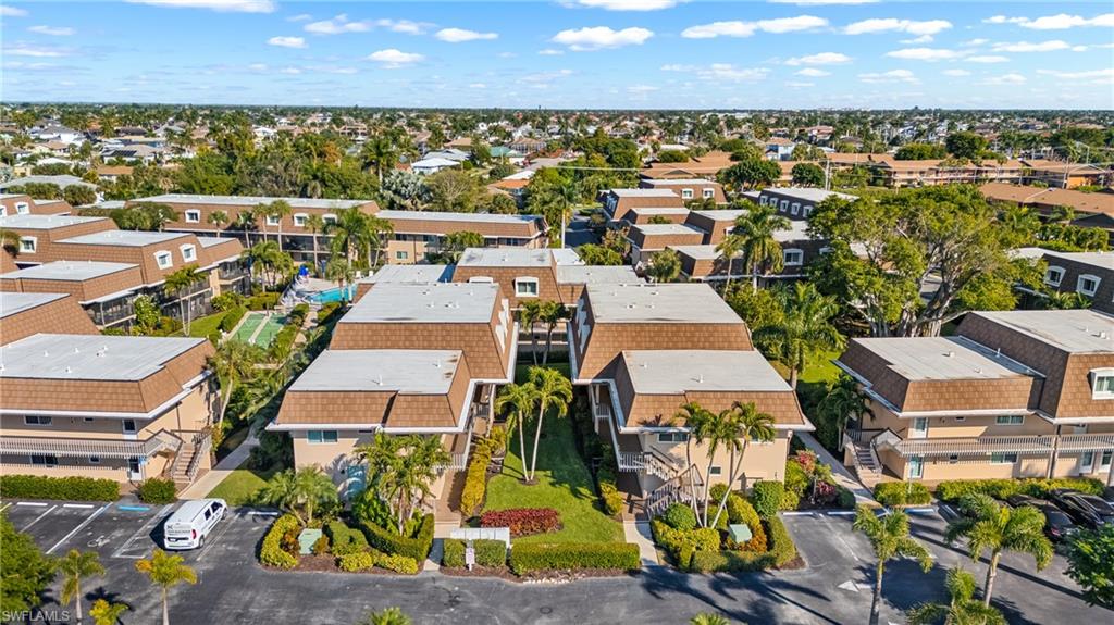 87 North Collier Boulevard, Unit B4 Marco Island, FL 34145 - Photo 20 of 31 an aerial view of residential houses with outdoor space and ocean view