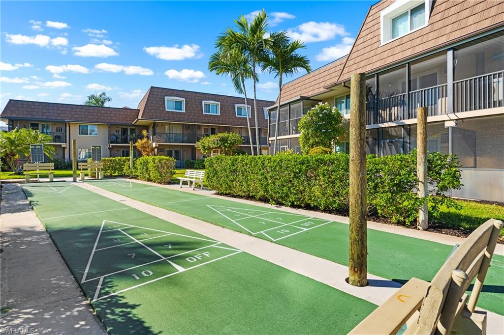 87 North Collier Boulevard, Unit B4 Marco Island, FL 34145 - Photo 26 of 31 a sign on the side of a road