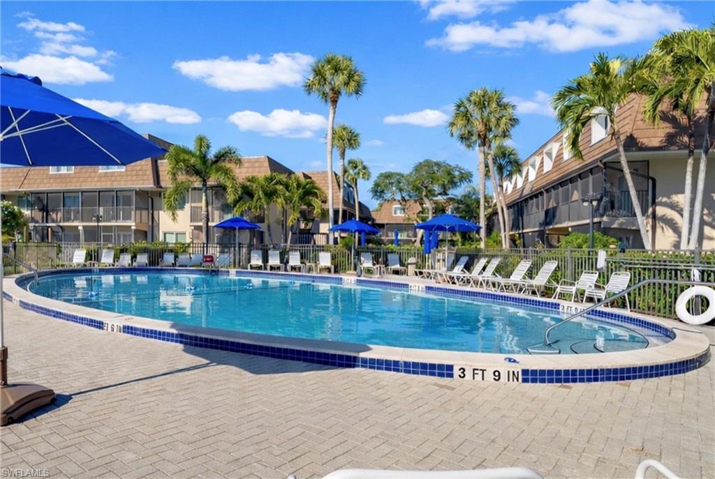 87 North Collier Boulevard, Unit B4 Marco Island, FL 34145 - Photo 28 of 31 a view of a house with swimming pool