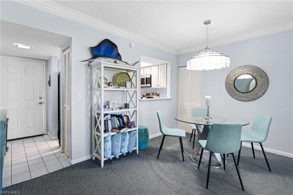 87 North Collier Boulevard, Unit B4 Marco Island, FL 34145 - Photo 8 of 31 a view of a dining room with furniture