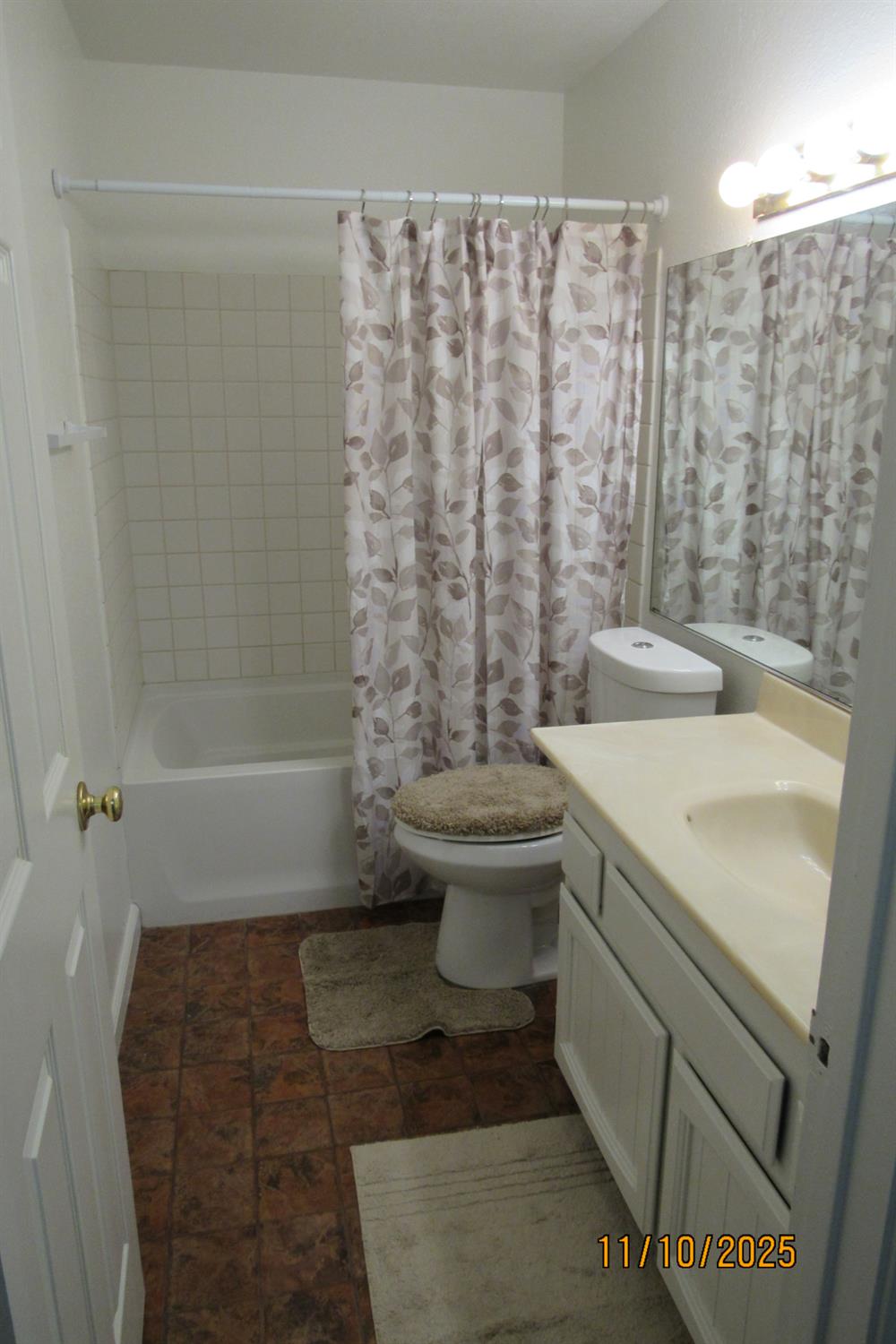 3400 Sullivan Court, Unit 106 Modesto, CA 95356 - Photo 11 of 18 a bathroom with a sink toilet and shower