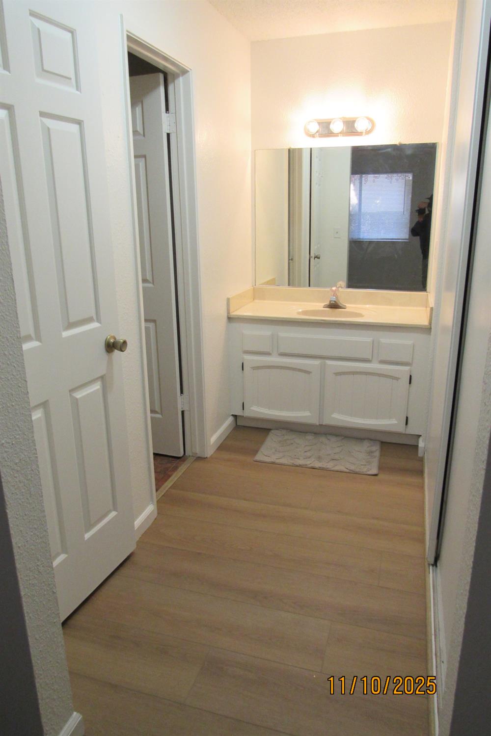 3400 Sullivan Court, Unit 106 Modesto, CA 95356 - Photo 14 of 18 a bathroom with a sink and a mirror