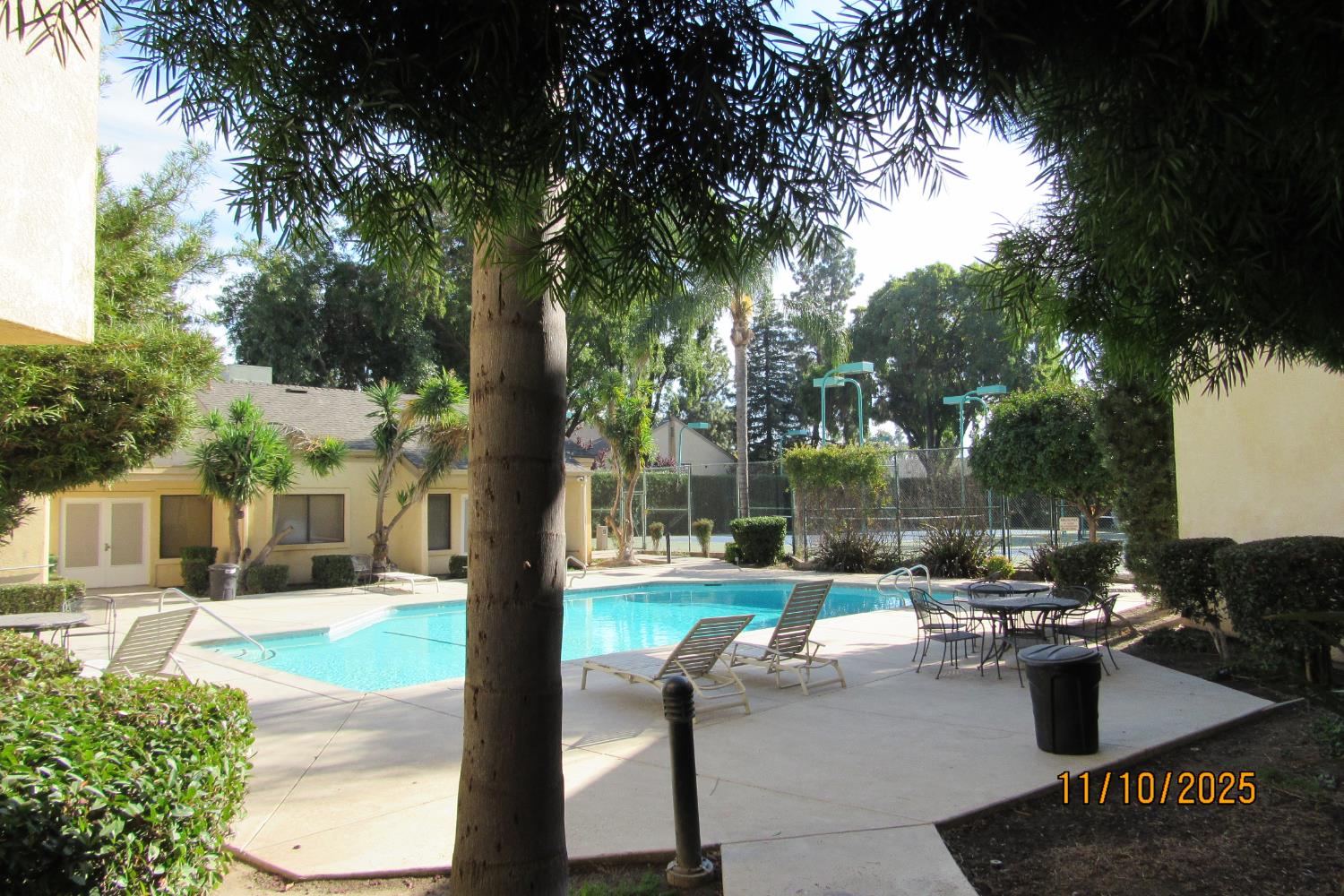 3400 Sullivan Court, Unit 106 Modesto, CA 95356 - Photo 18 of 18 a view of a patio with table and chairs and potted plants