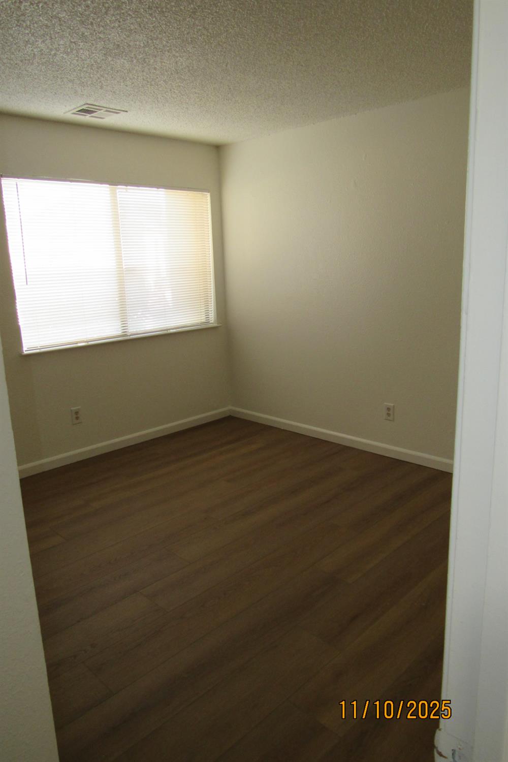 3400 Sullivan Court, Unit 106 Modesto, CA 95356 - Photo 9 of 18 a view of an empty room and window