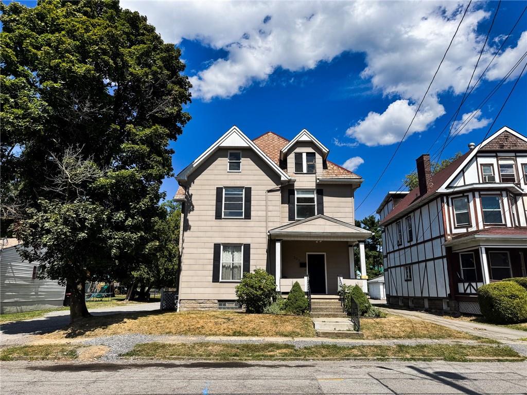 a front view of a house with a yard