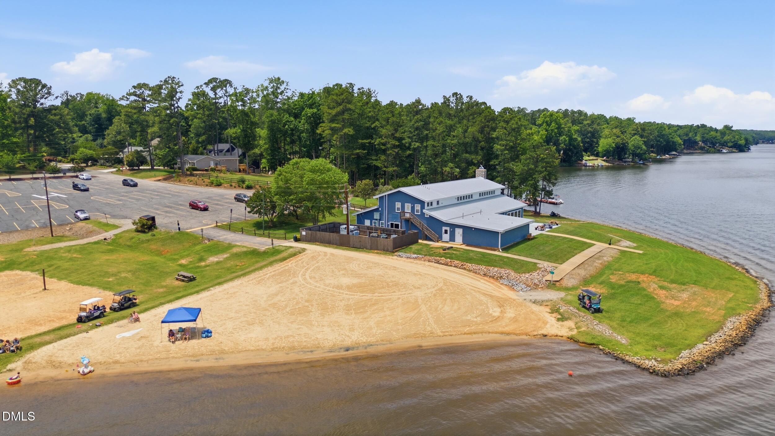 129 Shaman Drive Spring Hope, NC 27882 - Photo 37 of 43 an aerial view of a swimming pool and lake view