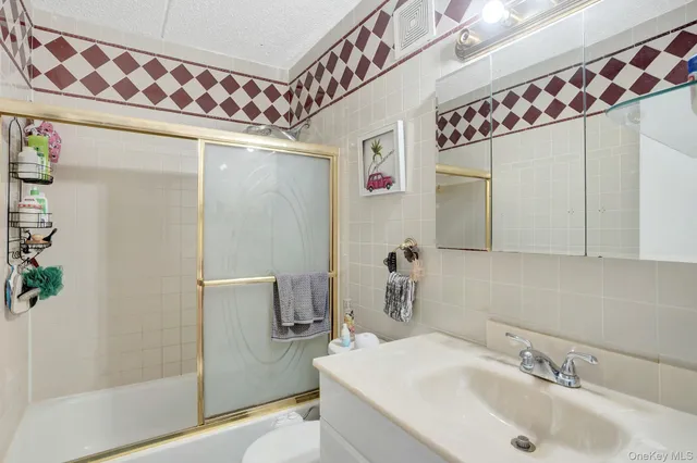 a bathroom with a sink and mirror